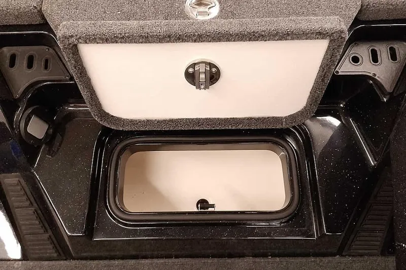 Slide: The Image of 2025 Ranger Z518 Ranger Cup Equipped storage compartment, featuring secure latch and carpeted interior. - 12