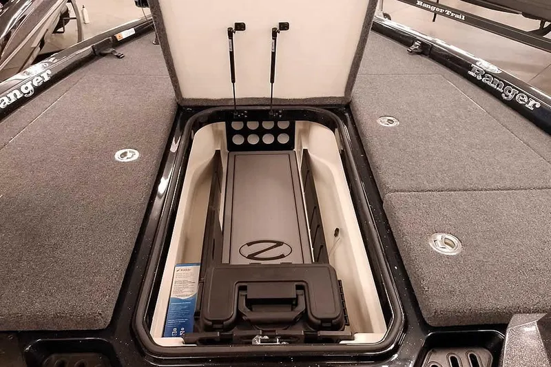 Slide: The Image of 2025 Ranger Z518 Ranger Cup Equipped boat storage compartment open, showcasing interior features. - 13