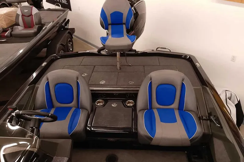 Slide: The Image of 2025 Ranger Z518 Ranger Cup Equipped boat interior with blue and gray seating. - 25
