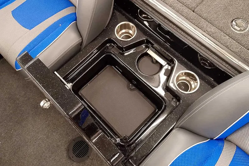 Slide: The Image of 2025 Ranger Z518 Ranger Cup Equipped boat interior with cup holders and storage compartment. - 26