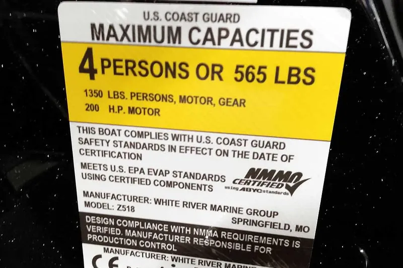 Slide: The Image of 2025 Ranger Z518 Ranger Cup Equipped boat capacity label, 4 persons or 565 lbs, 200 HP motor. - 28