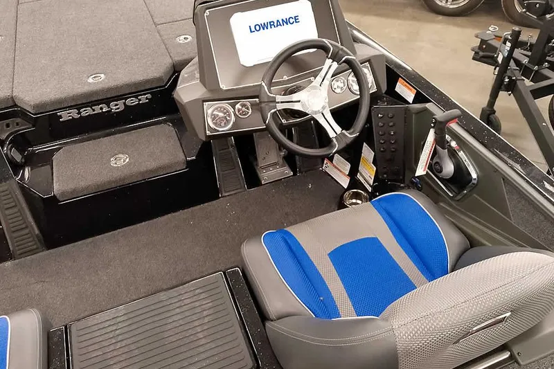 Slide: The Image of 2025 Ranger Z518 Ranger Cup Equipped boat interior with Lowrance system and blue seating. - 29