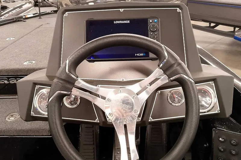 Slide: The Image of 2025 Ranger Z518 Ranger Cup Equipped boat dashboard with steering wheel and Lowrance display. - 31