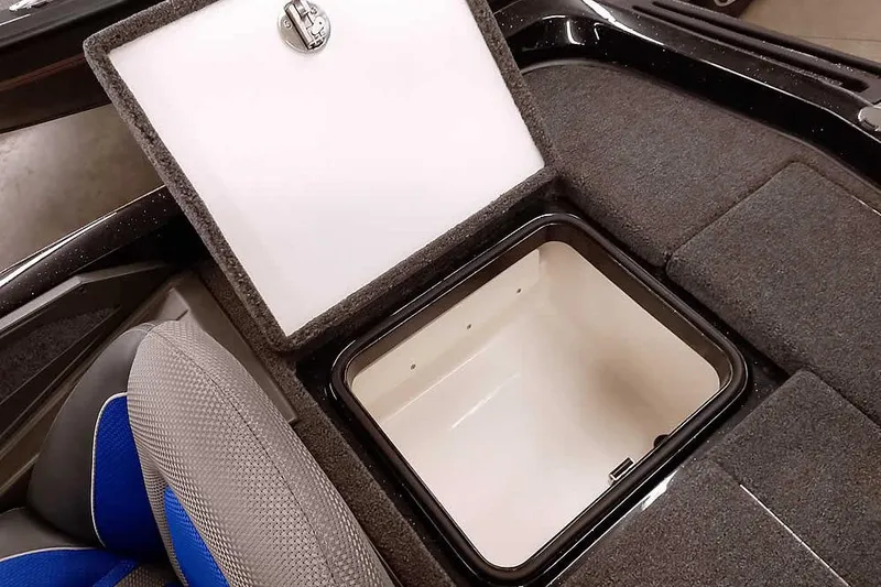 Slide: The Image of 2025 Ranger Z518 Ranger Cup Equipped boat storage compartment with open lid, showcasing interior space. - 35