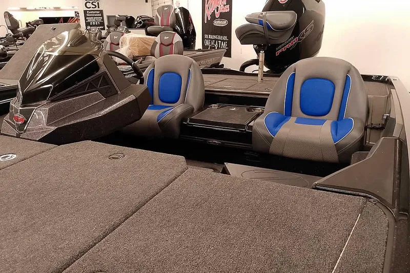 Slide: The Image of 2025 Ranger Z518 Ranger Cup Equipped boat interior with blue and gray seating. - 8