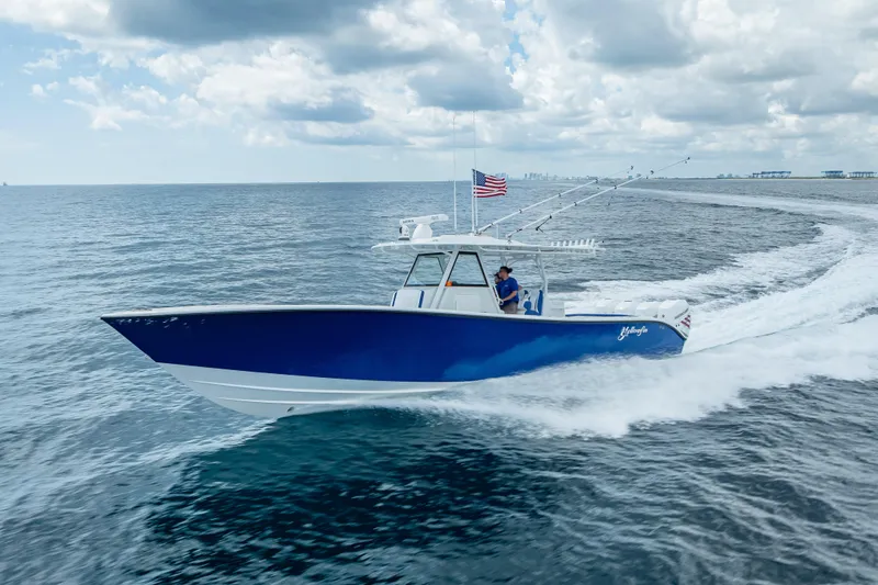 The Image of 2023 Yellowfin 39 Offshore boat cruising on open water under cloudy skies. - 0