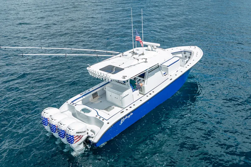Slide: The Image of 2023 Yellowfin 39 Offshore boat on open water, featuring quad Mercury engines. - 14