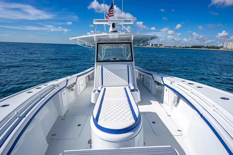 Slide: The Image of 2023 Yellowfin 39 Offshore boat on open water, featuring sleek design and spacious deck. - 33