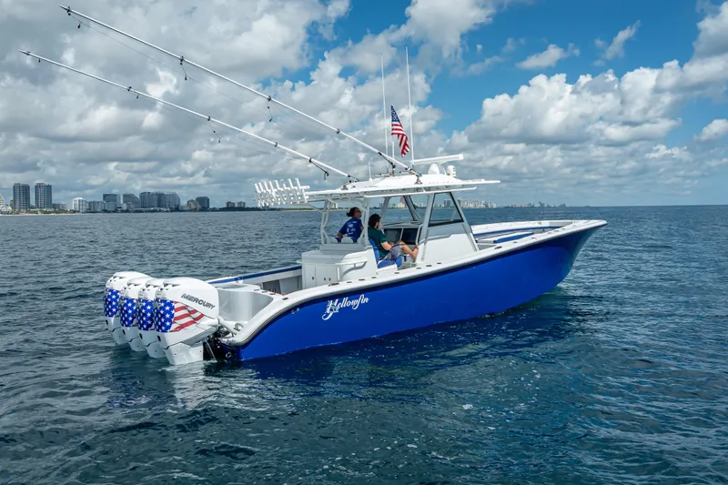 Slide: The Image of 2023 Yellowfin 39 Offshore boat on open water, featuring multiple outboard engines. - 4