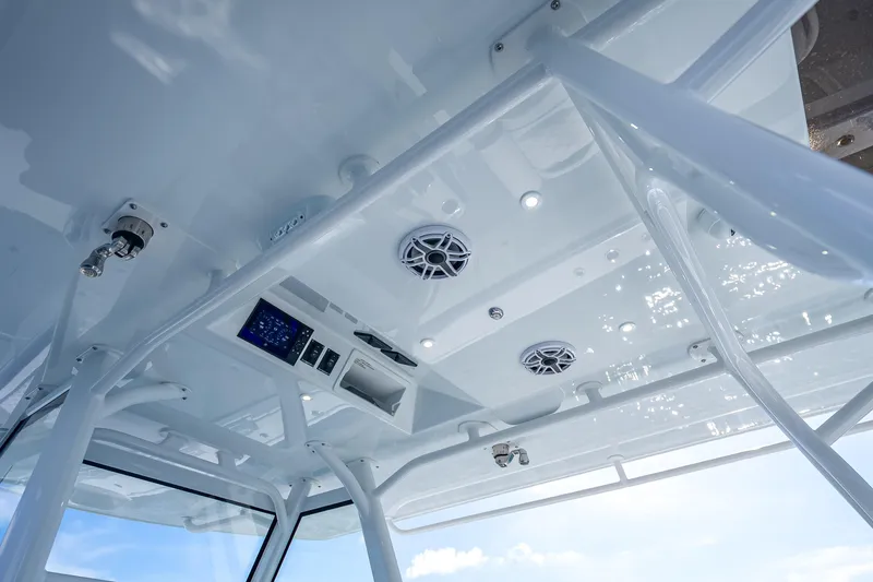Slide: The Image of 2023 Yellowfin 39 Offshore boat interior ceiling with speakers and control panel. - 42