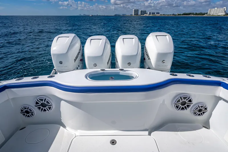 Slide: The Image of 2023 Yellowfin 39 Offshore boat with four powerful outboard engines on open sea. - 58