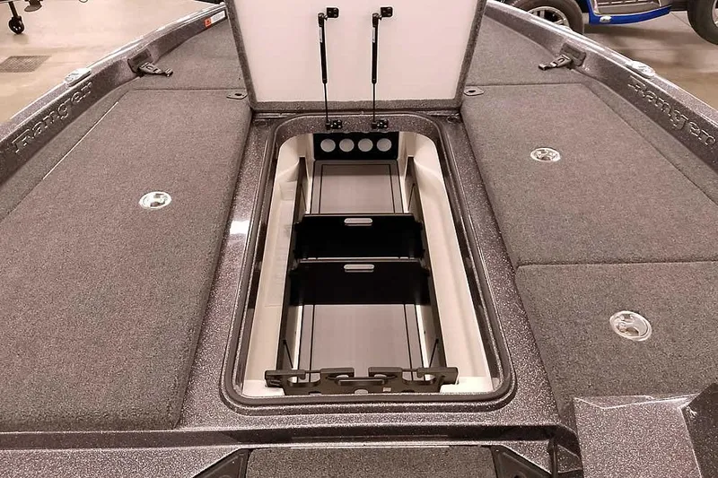 Slide: The Image of 2025 Ranger Z185 boat storage compartment with open lid, showcasing organized interior space. - 10
