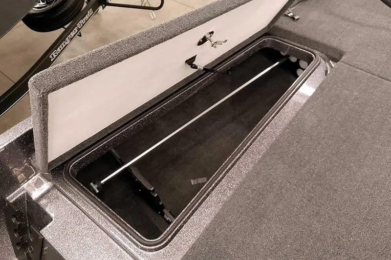 Slide: The Image of Open storage compartment in 2025 Ranger Z185 boat, showcasing interior space and design. - 13