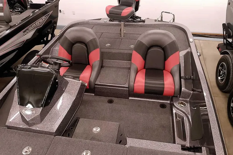 Slide: The Image of 2025 Ranger Z185 boat interior with dual black and red seats, steering console, and spacious deck. - 16