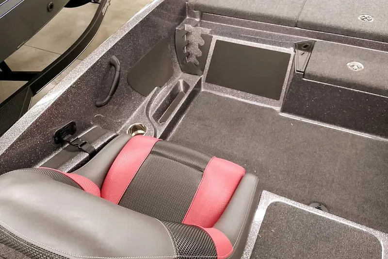 Slide: The Image of 2025 Ranger Z185 boat interior with red and black seating and storage compartments. - 17