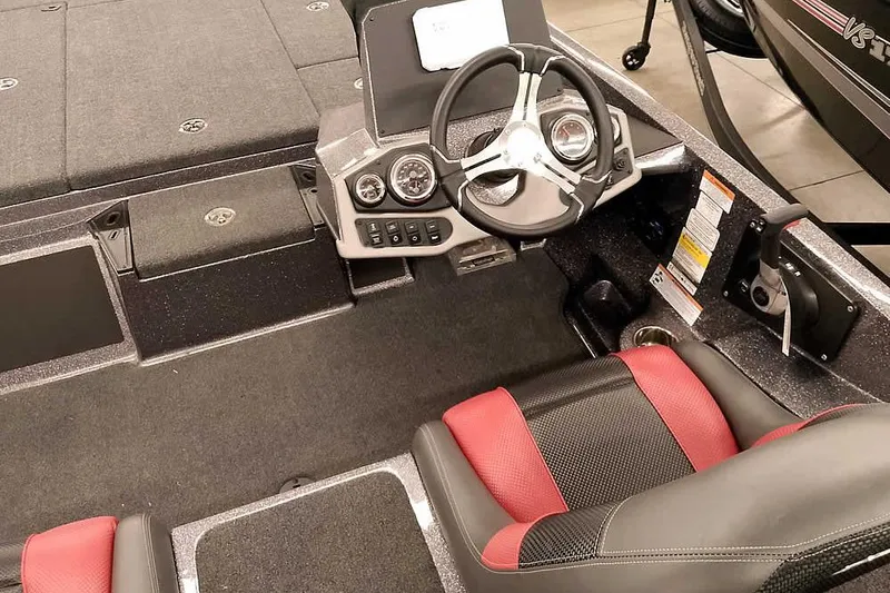 Slide: The Image of 2025 Ranger Z185 boat interior with steering wheel and red-black seating. - 19