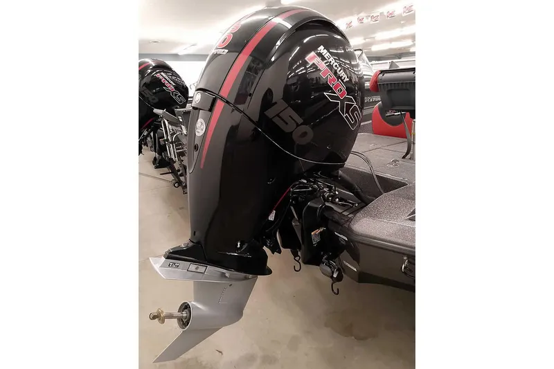Slide: The Image of 2025 Ranger Z185 boat with Mercury Pro XS 150 outboard motor in showroom. - 2