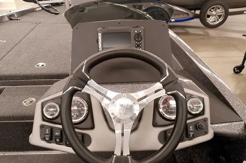 Slide: The Image of 2025 Ranger Z185 boat dashboard with steering wheel and control panel. - 20