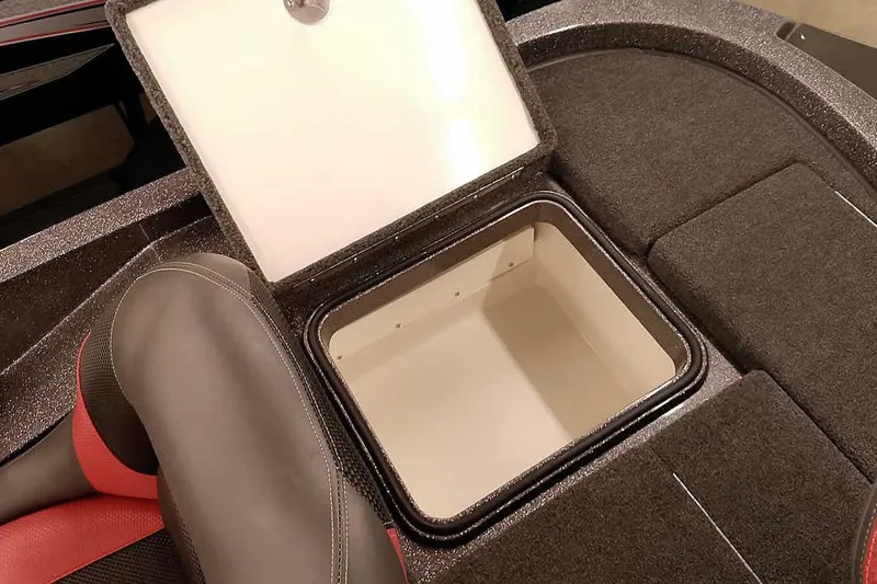 Slide: The Image of 2025 Ranger Z185 boat storage compartment with open lid, featuring cushioned seating. - 24