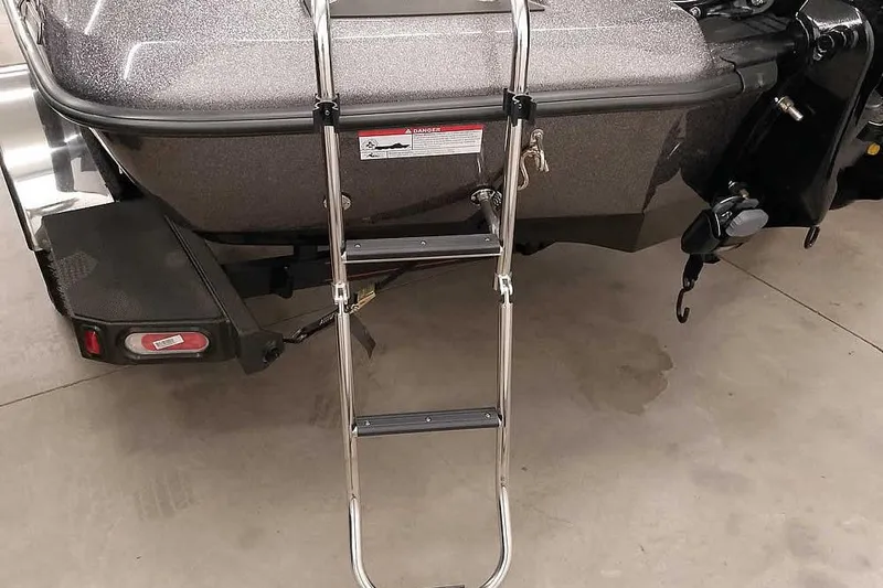 Slide: The Image of Rear view of 2025 Ranger Z185 boat with metal ladder attached. - 6