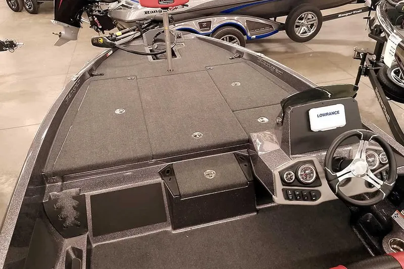 Slide: The Image of 2025 Ranger Z185 boat interior with steering wheel and Lowrance display, showcasing modern design. - 8