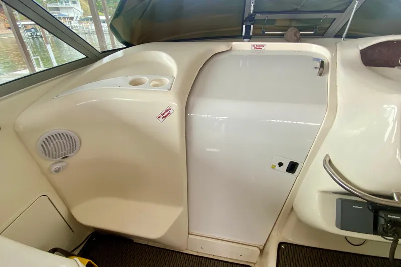 Slide: The Image of 1997 Sea Ray 330 Sundancer cabin entrance with speaker and control panel. - 11