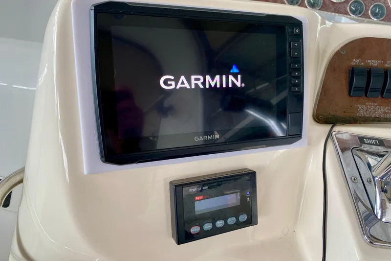 Slide: The Image of Garmin navigation system on 1997 Sea Ray 330 Sundancer boat dashboard. - 15