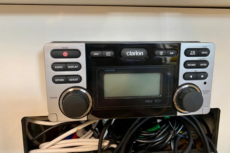 Slide: The Image of Clarion stereo system on 1997 Sea Ray 330 Sundancer boat dashboard. - 26