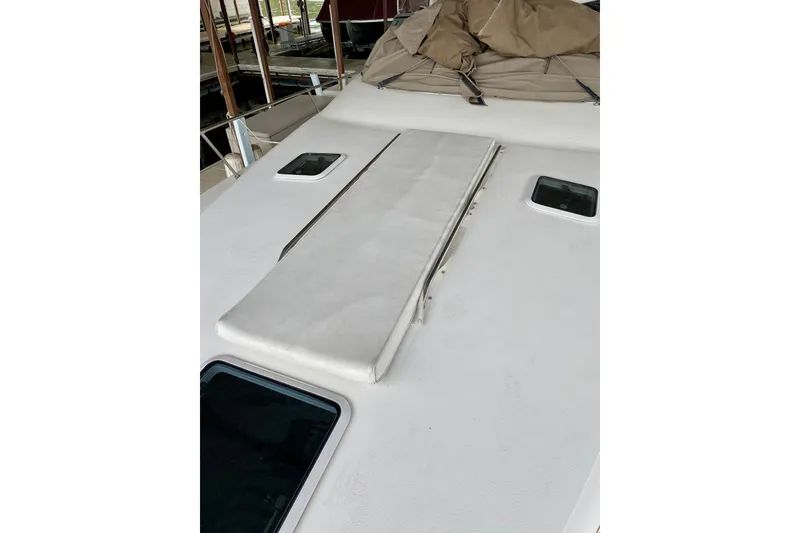 Slide: The Image of 1997 Sea Ray 330 Sundancer boat deck with sunpad and hatches. - 27