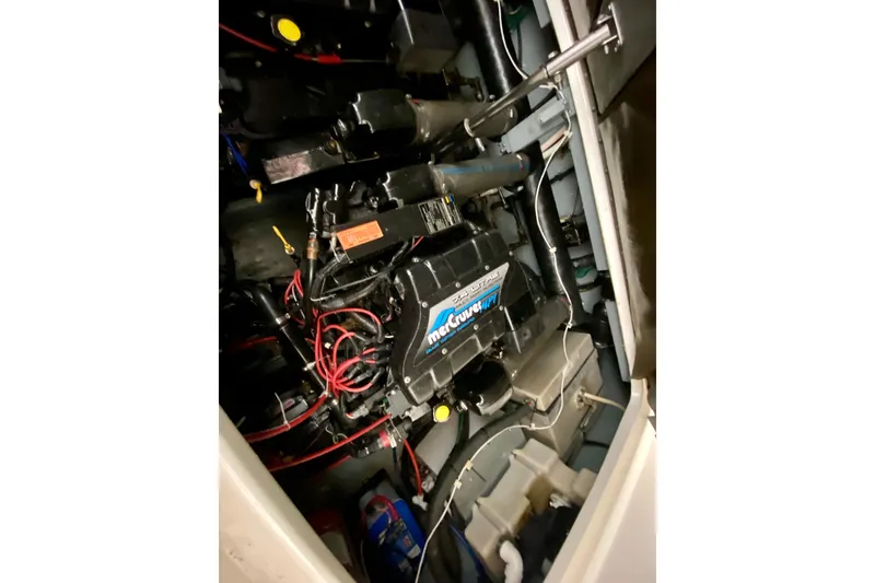 Slide: The Image of Engine compartment of a 1997 Sea Ray 330 Sundancer with MerCruiser components. - 30