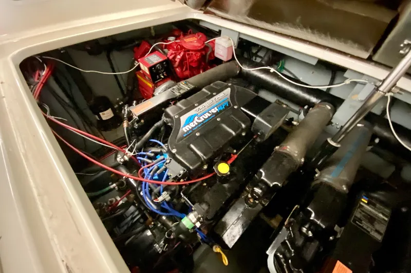 Slide: The Image of Engine compartment of 1997 Sea Ray 330 Sundancer with MerCruiser engine components. - 31
