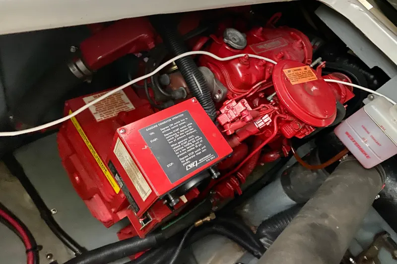 Slide: The Image of Engine compartment of a 1997 Sea Ray 330 Sundancer with red gasoline generator. - 32