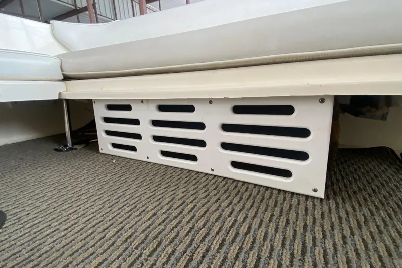 Slide: The Image of 1997 Sea Ray 330 Sundancer interior with vented panel and cushioned seating. - 8