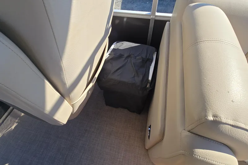 Slide: The Image of 2023 Sun Tracker Party Barge 22 RF DLX interior seating with storage area. - 37