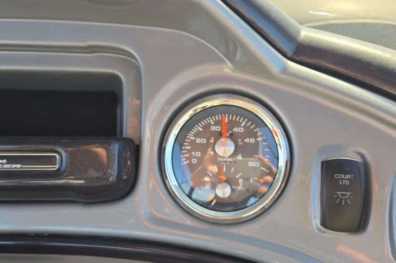 Slide: The Image of Dashboard of 2023 Sun Tracker Party Barge 22 RF DLX with speedometer and controls. - 52