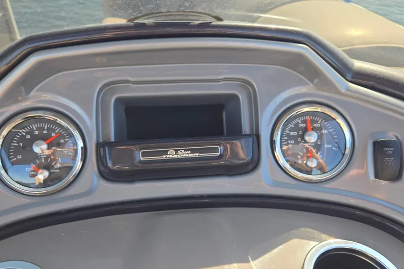 Slide: The Image of Dashboard of 2023 Sun Tracker Party Barge 22 RF DLX with gauges and controls. - 53