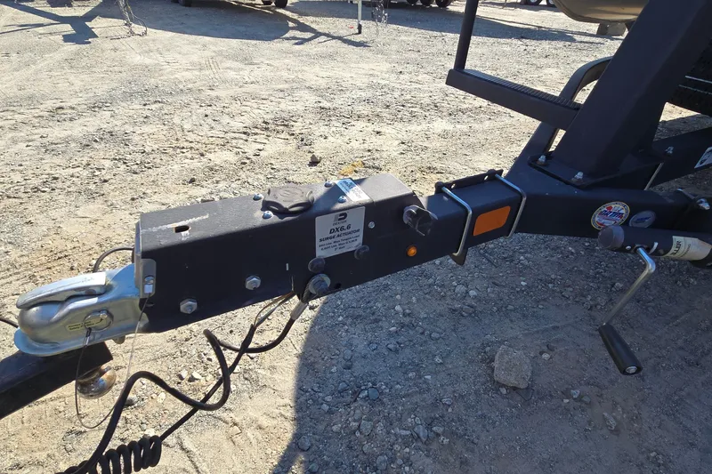 Slide: The Image of Trailer hitch of 2023 Sun Tracker Party Barge 22 RF DLX on gravel surface. - 54