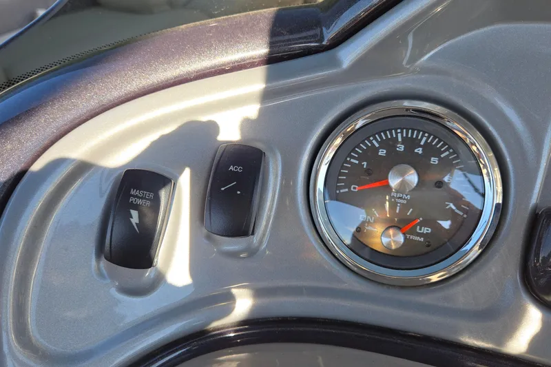 Slide: The Image of Control panel of 2023 Sun Tracker Party Barge 22 RF DLX with RPM gauge. - 59