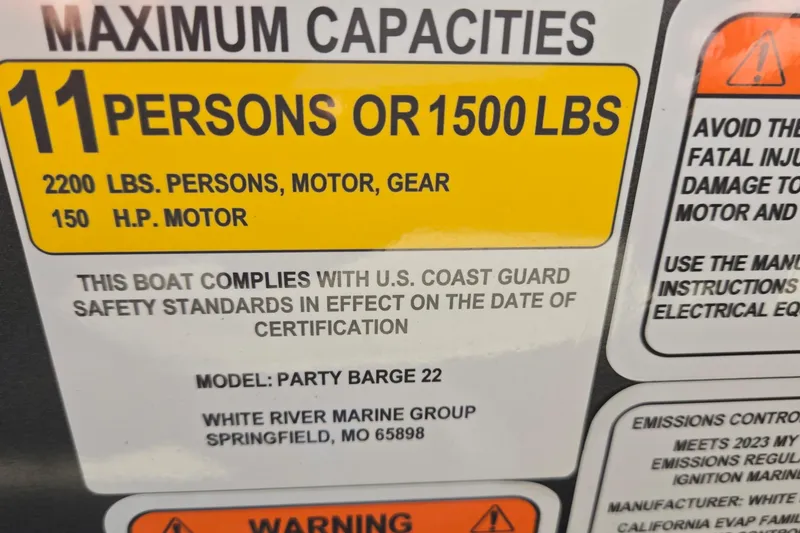 Slide: The Image of 2023 Sun Tracker Party Barge 22 RF DLX capacity label, 11 persons or 1500 lbs, safety standards compliant. - 71