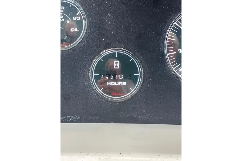 Slide: The Image of 1994 Silverton 41 Aft Cabin bathroom with dual sinks, mirror, and toilet. - 19