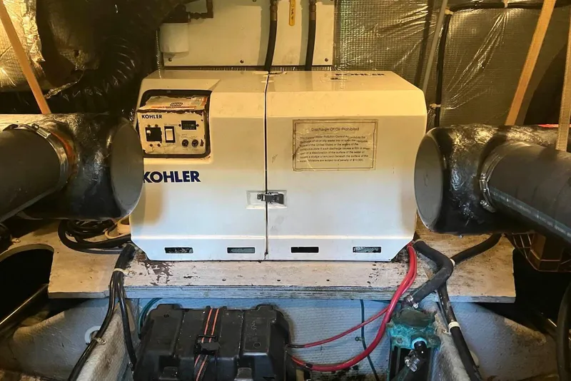 Slide: The Image of Engine room of 1994 Silverton 41 Aft Cabin with Kohler generator. - 22