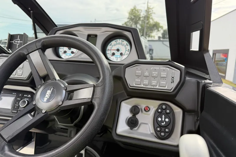 Slide: The Image of 2019 Axis A24 boat dashboard with steering wheel and control panel. - 15