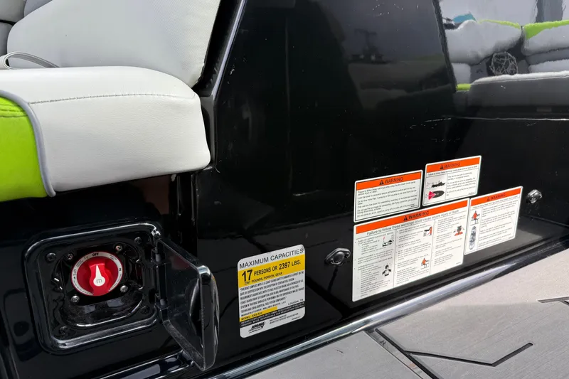 Slide: The Image of 2019 Axis A24 boat interior with safety warnings and capacity label. - 16