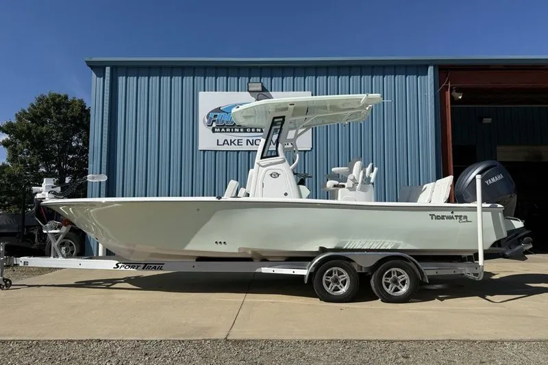 The Image of 2026 Tidewater 2500 Carolina Bay boat on trailer outside marine center. - 0