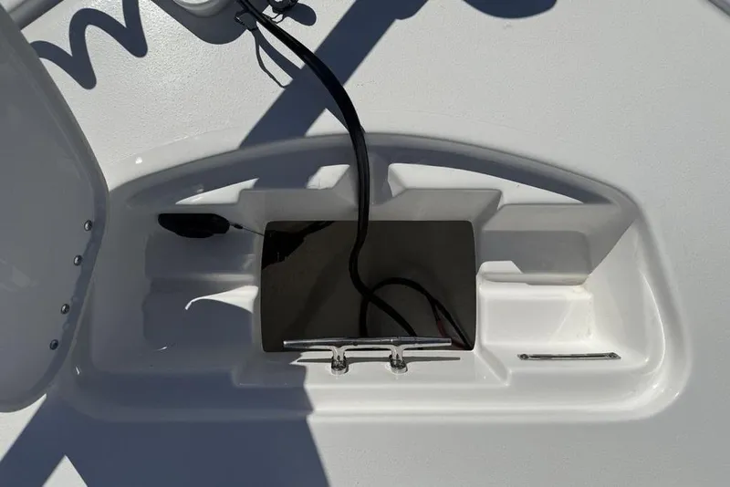 Slide: The Image of 2026 Tidewater 2500 Carolina Bay boat deck with storage compartment and cleat. - 11
