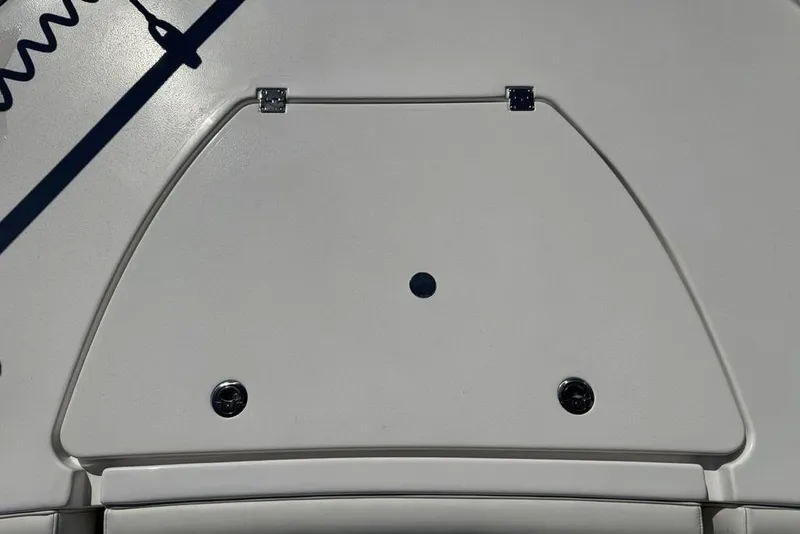 Slide: The Image of 2026 Tidewater 2500 Carolina Bay boat deck with storage compartment and hinges. - 13