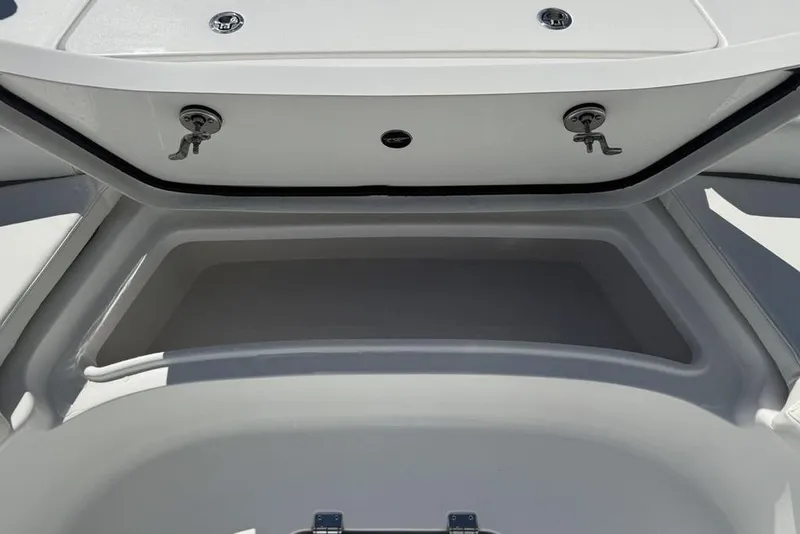 Slide: The Image of 2026 Tidewater 2500 Carolina Bay boat storage compartment, open and empty. - 16