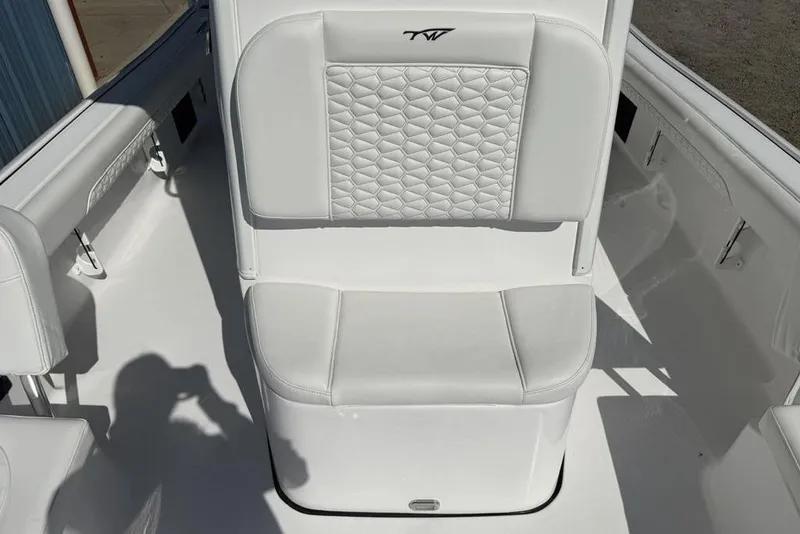 Slide: The Image of 2026 Tidewater 2500 Carolina Bay boat seat with quilted white upholstery. - 19