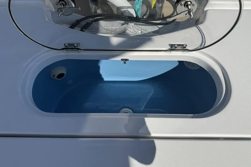 Slide: The Image of Open livewell on 2026 Tidewater 2500 Carolina Bay boat, showcasing interior design. - 29