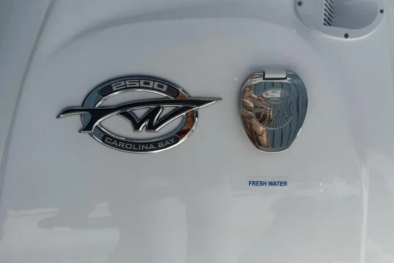 Slide: The Image of 2026 Tidewater 2500 Carolina Bay emblem and fresh water access on boat exterior. - 30